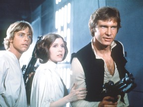 Mark Hamill as Luke Skywalker, Carrie Fisher as Princess Leia and Harrison Ford as Han Solo in Star Wars.