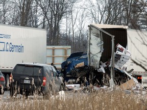 Emergency workers responded to a collision involving three transport trucks on the eastbound lanes of Hwy. 401 near Woodstock Friday morning. TARA BOWIE / SENTINEL-REVIEW / QMI AGENCY