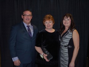 The Alberta Parenting for the Future Association received the Stony Plain and District Chamber of Commerce’s Marketer of the Year Award on Nov. 16. Pamela Geddes (centre) stands to receive the award during the evening. The association has since be named a contender for the Alberta Chamber of Commerce’s 2014 Marketing Award of Distinction which will be given on Feb. 28 at the Chamber’s award gala. - Thomas Miller, File Photo