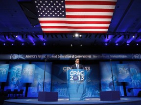 Former U.S. presidential candidate Mitt Romney stands onstage for remarks to the Conservative Political Action Conference (CPAC) in National Harbor, Maryland, March 15, 2013. REUTERS/Jonathan Ernst
