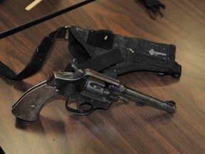 A loaded handgun found after a single-vehicle collision in Peterborough in 2011. (PETERBOROUGH EXAMINER/QMI Agency)