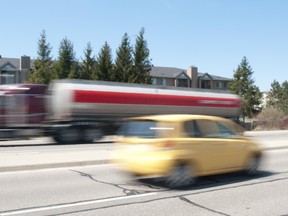 Traffic speeds along Veterans Memorial Parkway last spring. Residents backing onto the road, which sees about 25,000 vehicles daily, fought a long battle for a noise barrier. A community leader reviews the process. (London Free Press file Photo)