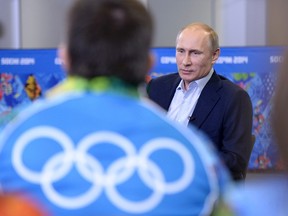 Russia's President Vladimir Putin meets with volunteers who are taking part in the preparations for the Sochi 2014 Winter Olympic Games in Sochi, January 17, 2014. (REUTERS/Alexei Nikolskyi/RIA Novosti/Kremlin)
