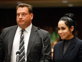 Nadya Suleman appears with her attorney Arthur J. La Cilento (L) for arraignment in Los Angeles, California January 17, 2014. Suleman, the California single mother of 14 children including octuplets who has been popularly dubbed "Octomom," has been charged with welfare fraud over accusations she lied about her income to authorities, prosecutors said on Monday.  REUTERS/Al Seib/Pool