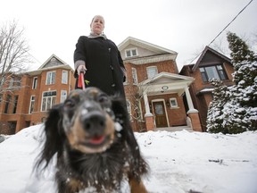 Lois Winstock with her dog outside of her home near Eglinton Ave. E. and Mount Pleasant Rd. in Toronto on Jan. 17, 2014. Winstock— who lives on the same street as Premier Kathleen Wynne — says she was without power for eight days. (Ernest Doroszuk/Toronto Sun)
