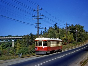 In this rare September, 1948 photo from the collection of transportation historian John Bromley we see one of the TTC’s North Yonge “radial” cars southbound on Yonge St. down into Hogg’s Hollow on its way to the terminal at Glen Echo (now the site of the Loblaws store opposite Yonge Blvd.). Its north terminal was in Richmond Hill. This service ended soon after this photo was taken. The term “radial” described the routes that radiated out from the city to communities west, north and east of the city. In the distance is the viaduct that was originally built as an extension of Yonge Blvd. intended to carry that thoroughfare over the valley of the West Don River. It connected the boulevard with Yonge St. north of the present Highway 401 interchange.