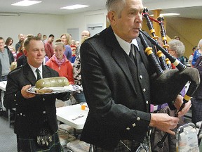 Piper Art Cogdale, from Carmangay, leads the march of the haggis with Sean Pooley carrying the traditional Scottish meal during last year's Robbie Burns supper at Champion's community hall. This year's event takes place Saturday, Jan. 25.
Advocate file photo