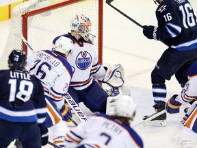 Jan 18, 2014; Winnipeg, Manitoba, CAN; Edmonton Oilers goalie Ilya Bryzgalov (80) is scored on by Winnipeg Jets defenseman Jacob Trouba (8) (not shown) during the third period at MTS Centre. Winnipeg wins 3-2. Mandatory Credit: Bruce Fedyck-USA TODAY Sports