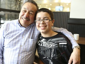 Stan Beardy, Grand Chief of the Nishnawbe Aski Nation with  his adopted son, Brayden photographed in Toronto on Jan. 18, 2013. (Veronica Henri/Toronto Sun)
