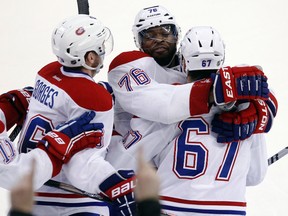 Montreal Canadiens defenceman P.K. Subban celebrates his game-winning overtime goal against the Ottawa Senators with teammates at the Canadian Tire Centre in Ottawa, Jan. 16, 2014. (DARREN BROWN/QMI Agency)