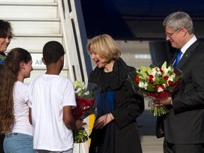 Prime Minister Stephen Harper, right, and his wife Laureen receive flowers from Israeli children after landing at Ben Gurion International Airport near Tel Aviv on January 19, 2014. (REUTERS/Heidi Levine/Pool)