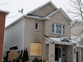 A fire at 112 Ashmore Dr. in Barrhaven displaced 4 people and caused $360,000 in damage on Sunday Jan. 19, 2014. 
Darren Brown/Ottawa Sun/QMI Agency