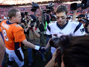 Denver Broncos quarterback Peyton Manning and New England Patriots quarterback Tom Brady shake hands after the 2013 AFC championship playoff game at Sports Authority Field at Mile High on Jan 19, 2014 in Denver, CO, USA. (Matthew Emmons/USA TODAY Sports)