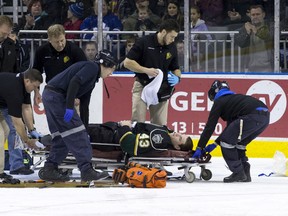 London Knights goaltender Anthony Stolarz is taken off the ice on a stretcher after receiving a cut to his leg during an OHL hockey game against the Saginaw Spirit at Budweiser Gardens in London, Ontario on Friday January 17, 2014.  (CRAIG GLOVER, The London Free Press)