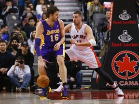 Lakers’ Pau Gasol (left) gave Raptors’ Jonas Valanciunas fits on Sunday at the ACC, rebounding with authority. (USA TODAY SPORTS/PHOTO)