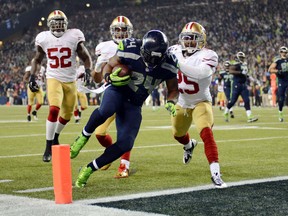 Seattle Seahawks running back Marshawn Lynch scores a touchdown against the San Francisco 49ers on Sunday in the NFC Championship game. Will Lynch also be a beast out east in the Super Bowl on Feb. 2? (Kyle Terada/USA TODAY Sports)