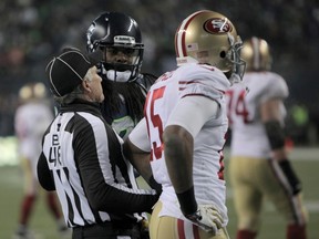 Seattle Seahawks cornerback Richard Sherman (C) taunts San Francisco 49ers wide receiver Michael Crabtree (R) after breaking up a pass in the endzone in the last minute of the NFC Championship football game in Seattle, January 19, 2014. (REUTERS/David Ryder)