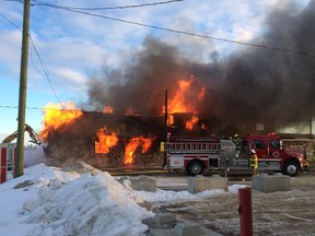 Firefighters douse a blaze at the Ryley Hotel on Sunday. The hotel, about 100 years old, burned to the ground. (Brian Strilchuk photo)