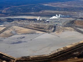 The Suncor plant and tailings pond at their operation north of Fort McMurray, Alberta, November 3, 2011. REUTERS/Todd Korol
