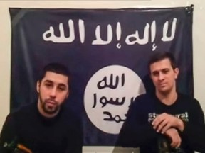 Men claiming to be from an Islamist militant group speak, in this still image taken from video footage posted on the Internet on January 20, 2014. (REUTERS/Handout via Reuters Television)