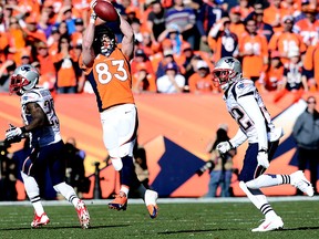 Denver Broncos wide receiver Wes Welker (83) catches a pass against the defence of New England Patriots free safety Devin McCourty (32) in the AFC Championship game at Sports Authority Field at Mile High.  (Ron Chenoy/USA TODAY Sports)