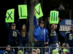 Seattle Seahawks fans hold up a sign for Super Bowl XLVIII during the NFC championship game against the San Francisco 49ers at CenturyLink Field January 19, 2014 in Seattle. (Christian Petersen/Getty Images/AFP)