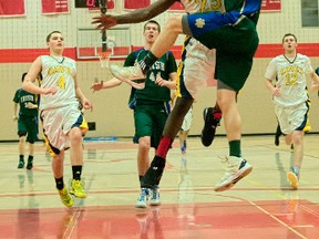 St. Patrick's senior boys' basketball team captured gold at a weekend tournament in London.
A total of 16 teams competed in the 13th annual Fanshawe College High School Senior Boys Basketball Tournament. Pictured is Chatham Kent Secondary School player Dan Allman (23) trying to stop St. Pats Jay McAuley (4) from driving to the basket for a shot during the championship game. St. Pats beat Chatham Kent SS 56-47. PHOTO SUBMITTED BY BRUCE SMITH