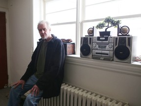 Dean Morrison, 60, sits in his new apartment in midtown. Evicted from his apartment in October, Morrison says the time he spent in a homeless shelter helped him get back on his feet.
Elliot Ferguson The Whig-Standard