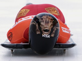 Mellisa Hollingsworth of Canada starts the first run of the women's skeleton event at the FIBT World Cup in St. Moritz in 2011.  
REUTERS/Denis Balibouse