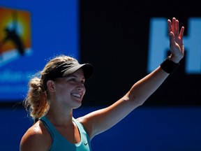 Eugenie Bouchard of Canada celebrates defeating Ana Ivanovic of Serbia in their women's quarter-final tennis match at the Australian Open 2014 tennis tournament in Melbourne January 21, 2014.    (REUTERS/Petar Kujundzic)