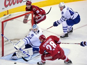 Leafs goalie Jonathan Bernier gets his pad out on Coyotes’ Lauri Korpikoski during the second period last night in Phoenix. Bernier made 39 saves in the game. (MATT KARTOZIAN/USA TODAY Sports)