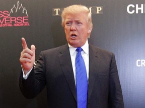 U.S. billionaire Donald Trump gestures as he arrives for the Miss Universe Pageant at Crocus City Hall in Moscow November 9, 2013. REUTERS/Maxim Shemetov