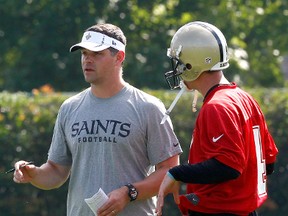 Former quarterbacks coach Joe Lombardi of the New Orleans Saints works with Sean Canfield at the Saints Practice Facility on May 24, 2012. (Sean Gardner/Getty Images/AFP)