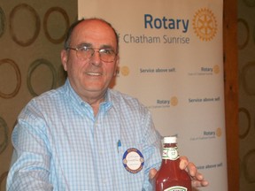 Phil Richards is past chair of the Ontario Processing Vegetables Growers. He'd like consumers to consider not only supporting local merchants when they shop, but consider buying locally-grown and locally-processed foods. He poses with a can of Aylmer tomatoes grown locally and produced in Dresden, and a bottle of Heinz ketchup made with local tomatoes and processed, at least for now, in Leamington.