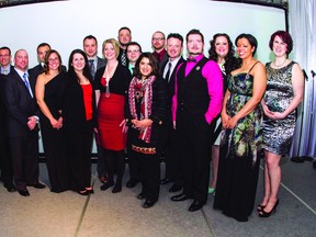 Jessica Lundy, centre front row in the red dress and pearls, poses for a picture along with other Top 20 Under 40 winners at the awards ceremony in Thunder Bay on Jan. 18.