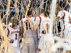 Russ Smith #2 (L) of the Louisville Cardinals celebrates after winning 82-76 against the Michigan Wolverines during the 2013 NCAA Men's Final Four Championship at the Georgia Dome on April 8, 2013 in Atlanta, Georgia.  (Andy Lyons/Getty Images/AFP)