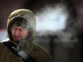 A man walks in down town Ottawa, On. Tuesday Jan 21, 2014. Temperatures were as low as -27C Tuesday.  Tony Caldwell/QMI Agency