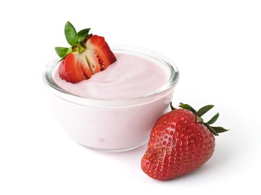 1 cup sliced strawberries, 1/2 cup 1-2% M.F. yogurt and 1 tsp. of honey. (Mny-Jhee/Fotolia)