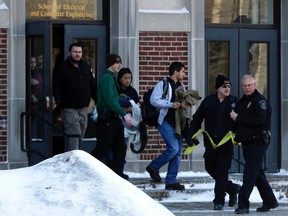 Students walk out of the Electrical Engineering Building at Purdue University in West Lafayette, Indiana January 21, 2014.  REUTERS/Nate Chute