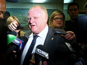 Mayor Rob Ford tells reporters at City Hall in Toronto on Tuesday January 21, 2014, that he was drinking Monday night which was caught on video. (Dave Abel/Toronto Sun)