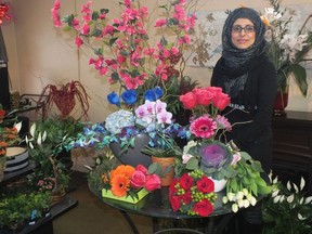 Aisha Mahmood stands in Murree Flowers, a store her father started in Byron 41 years ago.