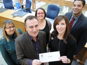 The annual Feed The Meter campaign in Belleville raised nearly $10,000 for The Hastings and Prince Edward Learning Foundation last month. On hand for the results announcement Tuesday were (from left) Food for Learning co-ordinator Kellie Brace, Mayor Neil Ellis; staffing co-ordinator with Adecco, Amy Clemens; executive director for the Hastings and Prince Edward Learning Foundation, Maribeth deSnoo and Jonathan Case, account manager with Scotiabank.
W. BRICE MCVICAR The Intelligencer