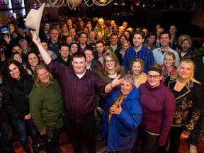 London?s MasterChef Canada contestant Andrew Lawton is surrounded by friends during a reception for the premiere of the show held at Jim Bob Ray?s on Monday night. (Mike Hensen/The London Free Press)