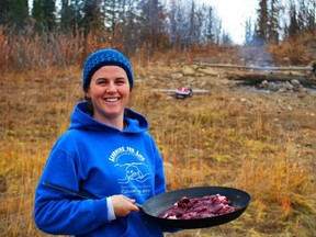 Frances Ross, who grew up in Kingston and graduated from Queen's University,  has helped set up a high school program for students in a northern Yukon community. Here she gets ready to cook fresh caribou meat.