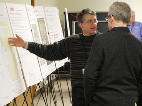 Jim Yardley, left, a consultant with Conestoga-Rovers and Associates, speaks with a Clean Harbors landfill neighbour at a Brigden open house on Clean Harbors' expansion plans Tuesday. Bruce Knight, right, lives near the landfill, and Larry Fedec is a consultant with AECOM. TYLER KULA/ THE OBSERVER/ QMI AGENCY