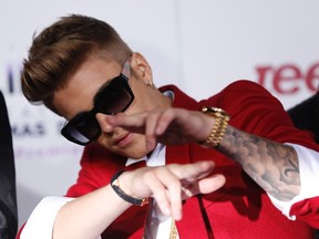 Singer Justin Bieber poses at the premiere of the documentary "Justin Bieber's Believe" in Los Angeles, California in this December 18, 2013, file photo. REUTERS/Mario Anzuoni/Files
