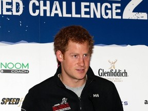 Britain's Prince Harry speaks at a news conference to welcome home members of the 'Walking With The Wounded South Pole Allied Challenge 2013' team, in central London on January 21, 2014. (REUTERS/Lefteris Pitarakis/Pool)