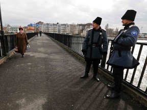 Russian Cossacks patrol the Adler district of Sochi January 22, 2014. Sochi will host the 2014 Winter Olympic Games from February 7 to 23. REUTERS/Alexander Demianchuk