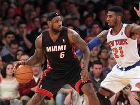 Miami Heat small forward LeBron James (6) controls the ball against New York Knicks shooting guard Iman Shumpert (21) during the third quarter of a game at Madison Square Garden. (Brad Penner-USA TODAY Sports)