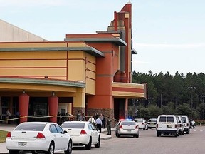 Police tape surrounds the Cobb Grove 16 movie theatre in Wesley Chapel, Florida January 13, 2014. (REUTERS/Mike Carlson)